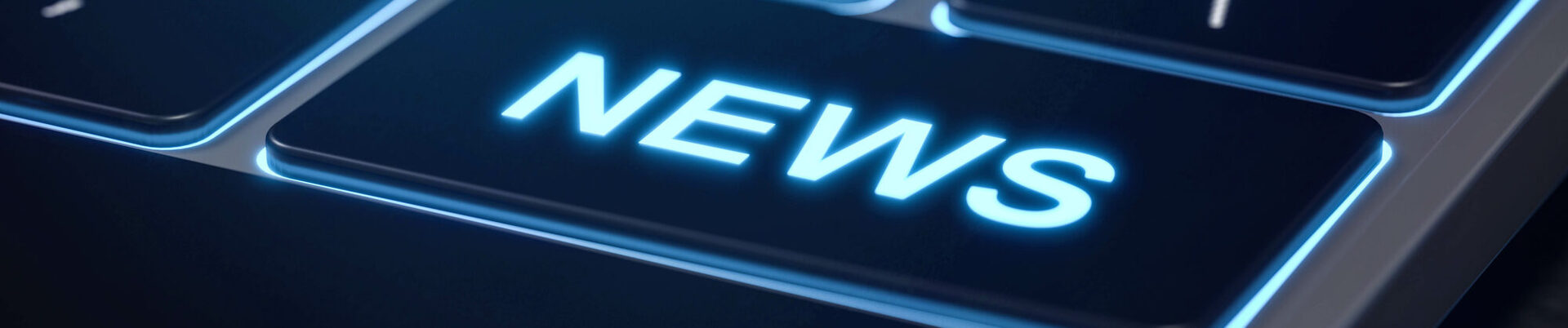 Auf einer schwarzen Laptoptastatur ist ein Eingabefeld mit dem Schriftzug News