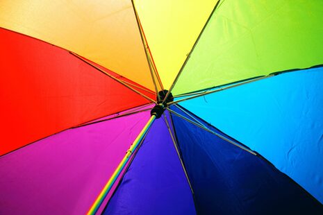 An umbrella with bright rainbow colors