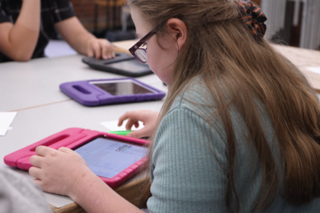 A girl with an iPad